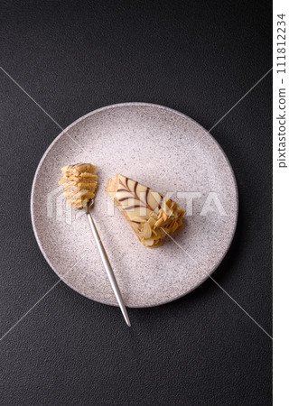 Piece of delicious sweet esterhazy cake with nuts and cream 111812234