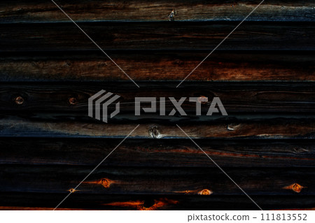 Dark wooden background almost black. Burnt wooden surface. Dark wooden background almost black. Burnt wooden surface. 111813552