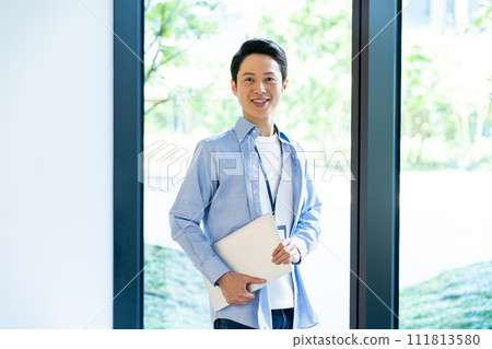 Businessman with a laptop computer shooting cooperation "LINK FOREST" Businessman with a laptop computer shooting cooperation "LINK FOREST" 111813580