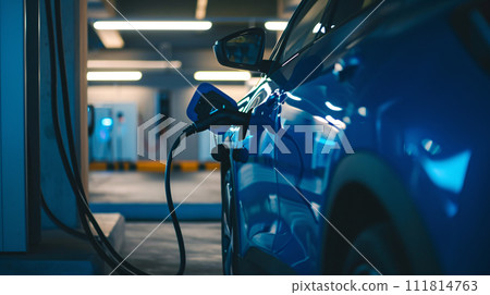 an electric vehicle gracefully connected to a charging station point an electric vehicle gracefully connected to a charging station point 111814763