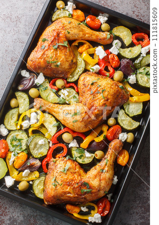 Greek Sheet Pan Chicken With Vegetables and Feta closeup. Vertical top view Greek Sheet Pan Chicken With Vegetables and Feta closeup. Vertical top view 111815609
