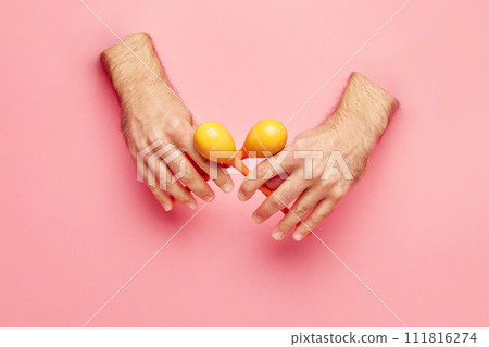 Male hands sticking out pink background and playing maracas. Flyer for cultural festival with different musical experiences. Male hands sticking out pink background and playing maracas. Flyer for cultural festival with different musical experiences. 111816274