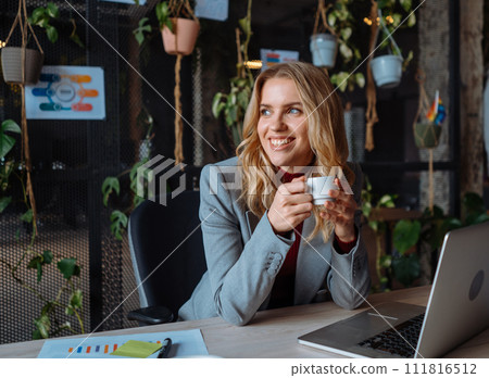 Portrait view of the attractive senior guy is posing to the camera at green plants office Portrait view of the attractive senior guy is posing to the camera at green plants office 111816512