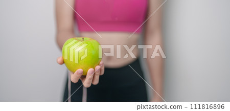 woman hand hold green Apple, happy female fitness choose fruit is Healthy food. Dieting control, Weight loss, Obesity, eating lifestyle and nutrition concepts woman hand hold green Apple, happy female fitness choose fruit is Healthy food. Dieting control, Weight loss, Obesity, eating lifestyle and nutrition concepts 111816896