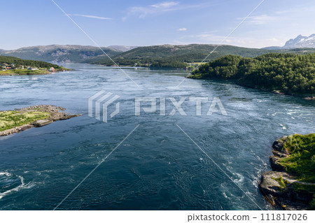 Captured from above, the dynamic Saltstraumen tide contrasts with serene Nordic scenery 111817026