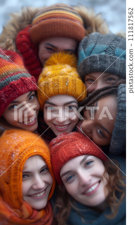 Joyful friends in winter wear embracing tightly 111817562