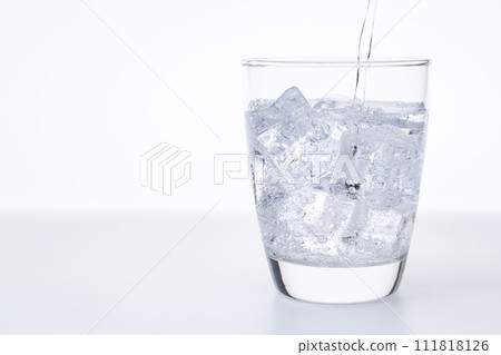 Carbonated water poured into the glass 111818126