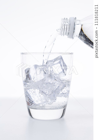 Carbonated water poured into the glass Carbonated water poured into the glass 111818211