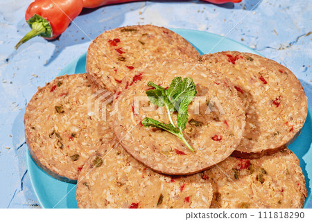 slices of vegan roll on a blue plate 111818290