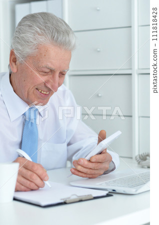 Close up portrait of happy senior businessman 111818428