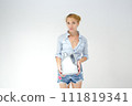 Woman holding canister of motor oil on light background 111819341