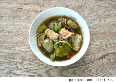 hot and spicy wild boar with variety vegetable and Thai herbs soup on bowl hot and spicy wild boar with variety vegetable and Thai herbs soup on bowl 111819349