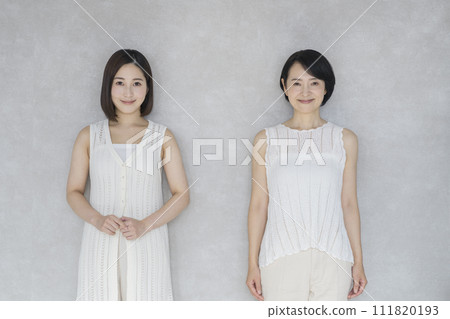 Smiling women in their 20s and 50s, mother and daughter image portrait 111820193