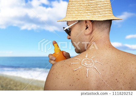 Middle aged caucasian male model applying sunscreen 111820252