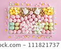 Easter sweet charcuterie board with chocolate eggs on pink background. Top view. 111821737