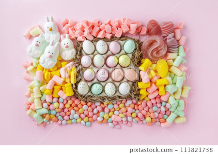 Easter sweet charcuterie board with chocolate eggs on pink background. Top view. Easter sweet charcuterie board with chocolate eggs on pink background. Top view. 111821738