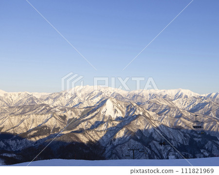 The sun sets on a beautiful snowy mountain The sun sets on a beautiful snowy mountain 111821969