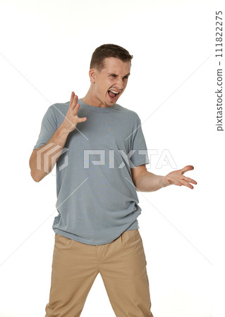 annoyed angry man shouting on white studio background 111822275