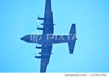 C-130H Hercules transport aircraft flying overhead C-130H Hercules transport aircraft flying overhead 111822458
