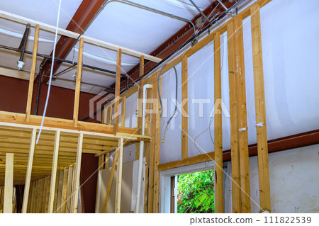New construction home wooden framing with beams stick framework New construction home wooden framing with beams stick framework 111822539