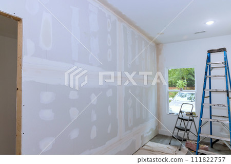 As construction of new house, plastering drywall have been completed so house is ready to be painted 111822757