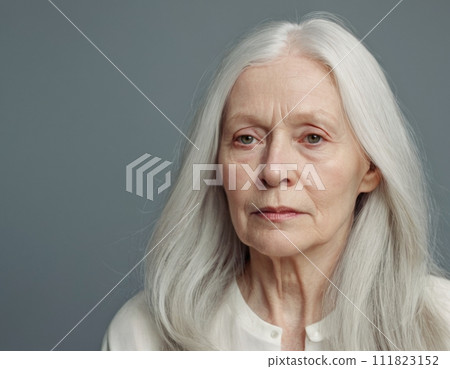 Sad elderly woman in black clothes. Portrait of a minimalist. 111823152