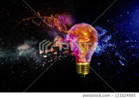 Exploding light bulb with colorful sparks 111824885
