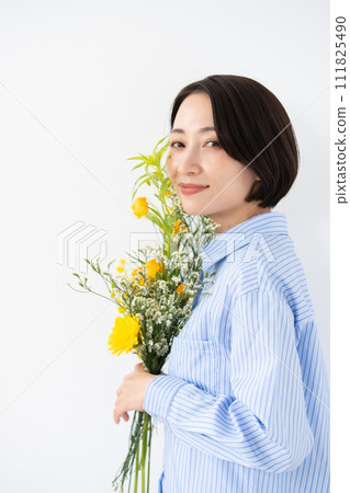 Woman holding flowers, sideways Woman holding flowers, sideways 111825490
