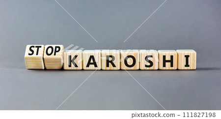 Stop karoshi symbol. Concept words Karoshi or Stop karoshi on beautiful wooden blocks. Beautiful grey table grey background. Business and stop karoshi concept. Copy space. 111827198