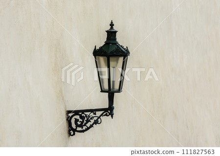 Lantern on a beige wall. Lantern on a beige wall. 111827563