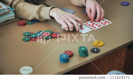 High school students play poker in their free time. 111828571