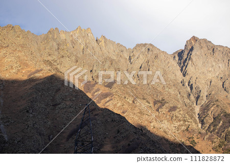 The sun-drenched brown cold mountains of the Caucasus The sun-drenched brown cold mountains of the Caucasus 111828872
