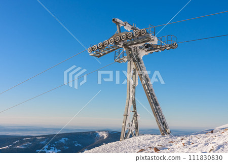 Ski lift pylon, chairlift in Krkonose  mountains in winter day, snezka, mountain on the border between Czech Republic and Poland 111830830