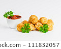 Breaded chicken nuggets. Breaded Chicken Inner Fillet with green lettuce leaves on a White Background,Chicken Breaded Raw Meat,Fillet.Fast homemade food at home.Chicken breaded schnitzels.Fast cooking 111832057