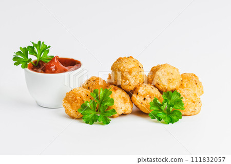 Breaded chicken nuggets. Breaded Chicken Inner Fillet with green lettuce leaves on a White Background,Chicken Breaded Raw Meat,Fillet.Fast homemade food at home.Chicken breaded schnitzels.Fast cooking 111832057