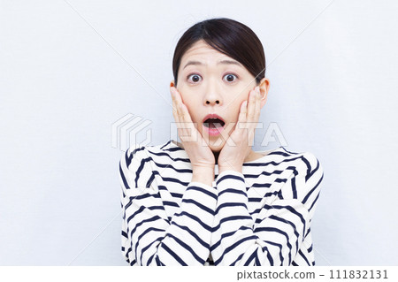 Surprised woman in her 40s Surprised woman in her 40s 111832131