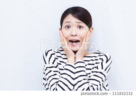 Surprised woman in her 40s Surprised woman in her 40s 111832132