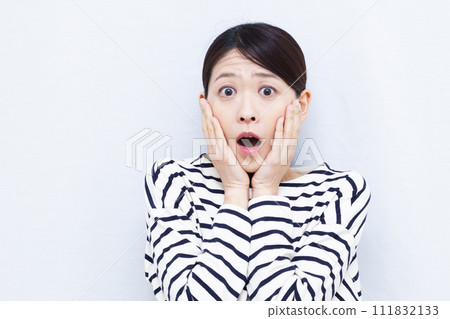 Surprised woman in her 40s Surprised woman in her 40s 111832133