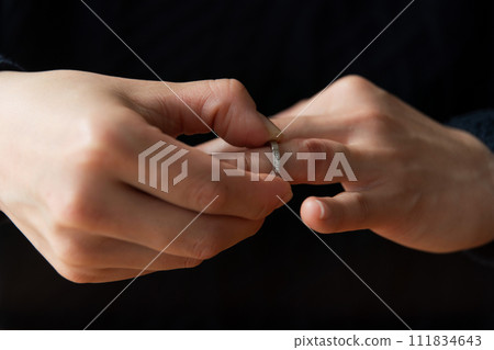 Photo of hand removing ring Photo of hand removing ring 111834643