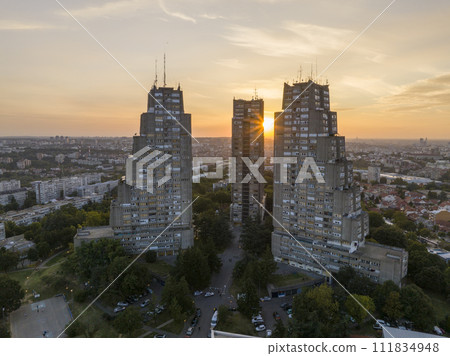 East gate of Belgrade, Silhouette of Brutalist Condominium complex at sunset. Aerial of unique Architecture in Serbia 111834948