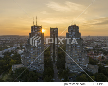 East gate of Belgrade, Silhouette of Brutalist Condominium complex at sunset. Aerial of unique Architecture in Serbia 111834950