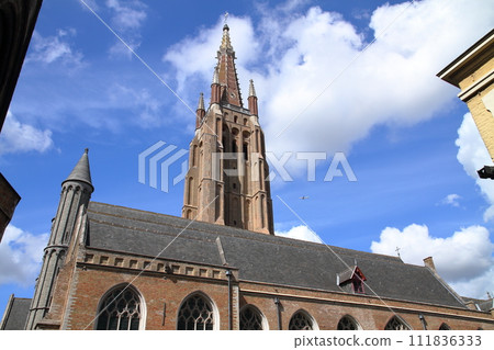 The spire of the Cathedral of Our Lady in the historic center of Bruges (Brugge), a world cultural heritage site in Belgium, Western Europe The spire of the Cathedral of Our Lady in the historic center of Bruges (Brugge), a world cultural heritage site in Belgium, Western Europe 111836333
