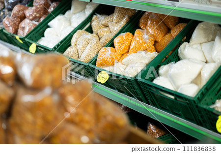 Various packaged bulk food products arranged on shelves in grocery store Various packaged bulk food products arranged on shelves in grocery store 111836838