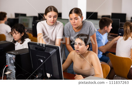 Teacher and teenagers student studying in computer class Teacher and teenagers student studying in computer class 111837263