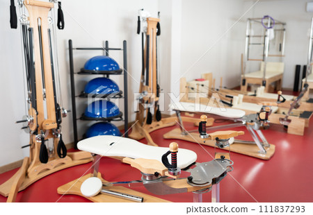 Studio with exercise machines and pilates equipment Studio with exercise machines and pilates equipment 111837293