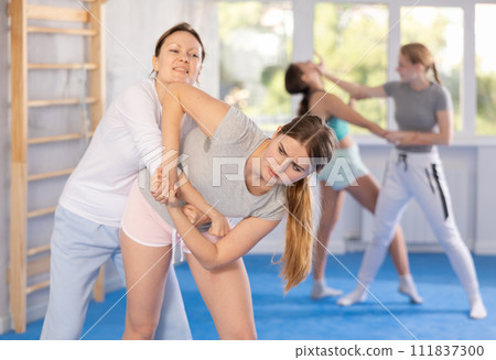 Females practicing self defence moves Females practicing self defence moves 111837300