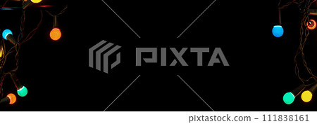 Christmas Glowing Colorful Lights on Black background. Selective Focus Photo. Christmas Glowing Colorful Lights on Black background. Selective Focus Photo. 111838161