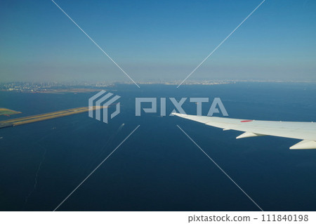 Haneda Airport Tokyo Bay view Tokyo runway plane window view from the plane window Haneda Airport Tokyo Bay view Tokyo runway plane window view from the plane window 111840198