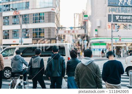 People in Ueno crossing street during go to Nakacho market, Ueno, a red-light district with many clubs and hostess bars. Landmark for tourist attraction in Ueno. Tokyo, Japan, 18 November 2023 111842005