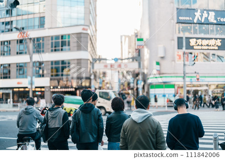 People in Ueno crossing street during go to Nakacho market, Ueno, a red-light district with many clubs and hostess bars. Landmark for tourist attraction in Ueno. Tokyo, Japan, 18 November 2023 People in Ueno crossing street during go to Nakacho market, Ueno, a red-light district with many clubs and hostess bars. Landmark for tourist attraction in Ueno. Tokyo, Japan, 18 November 2023 111842006